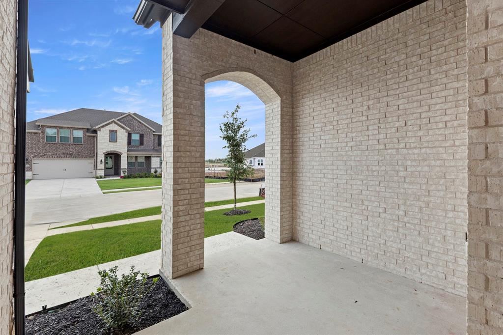 1013 Butterfly Lane Justin, TX 76247 - Photo 3 of 34 1013-butterfly-ln-justin-tx-covered-front-porch