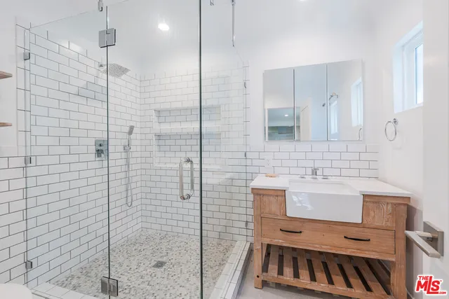 a bathroom with a sink and a shower