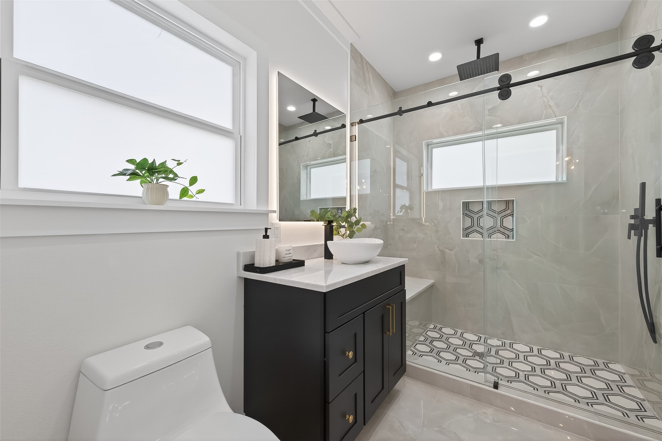 13714 New Shiloh Road Cypress, TX 77429 - Photo 8 of 14 a bathroom with a sink a toilet and shower