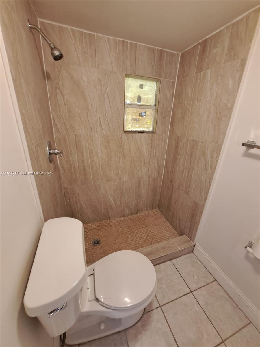 1362 Southwest 2nd Street, Unit 9 Miami, FL 33135 - Photo 4 of 5 a bathroom with a toilet and a shower