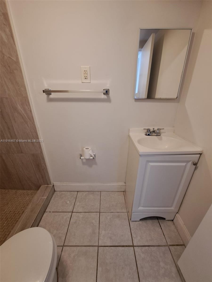 1362 Southwest 2nd Street, Unit 9 Miami, FL 33135 - Photo 5 of 5 a bathroom with a sink toilet and mirror