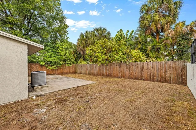a backyard of a house with lots of green space