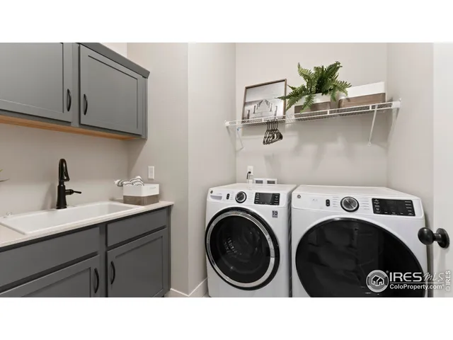 a bathroom with a sink and a washer