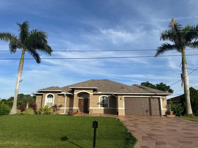 front view of a house with a yard