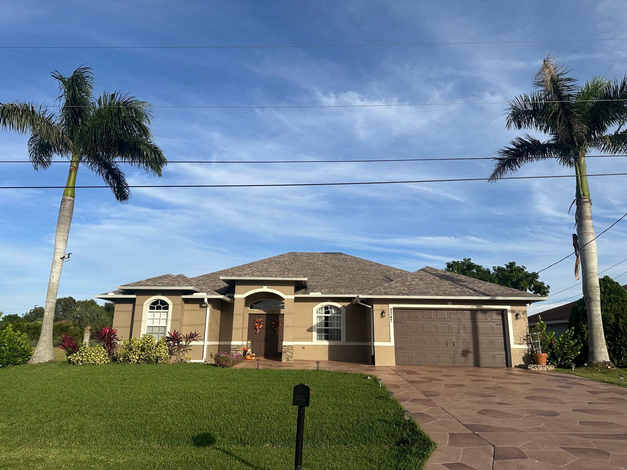 front view of a house with a yard