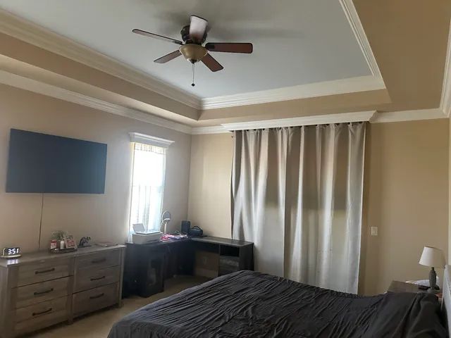 a bedroom with furniture and a window