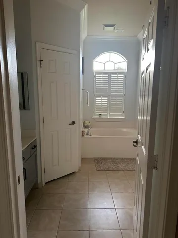 a bathroom with a bathtub and a shower