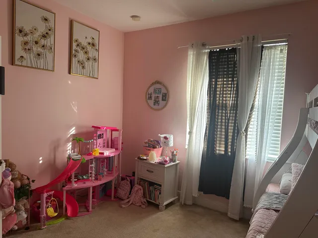 a bedroom with a bed and a desk