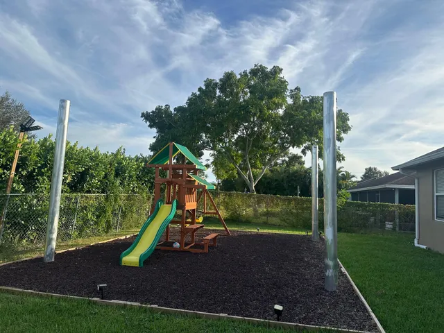 a backyard of a house with lots of green space