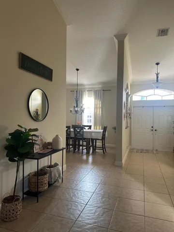 a view of a dining room and livingroom with furniture and window