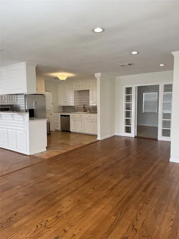 a view of a kitchen with a sink and a stove