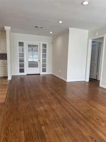 a large kitchen with cabinets and stainless steel appliances
