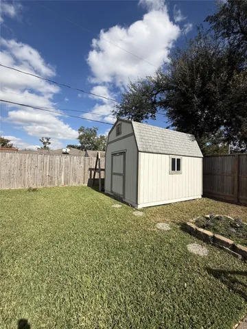 a view of a backyard of the house