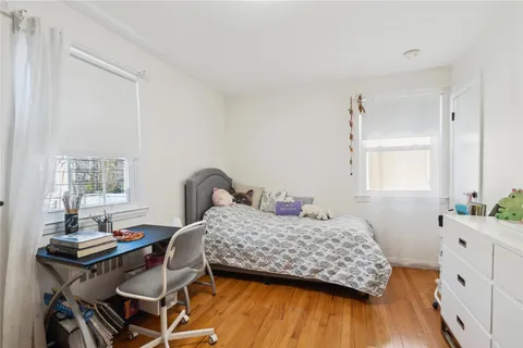 a bedroom with a bed and a table in it