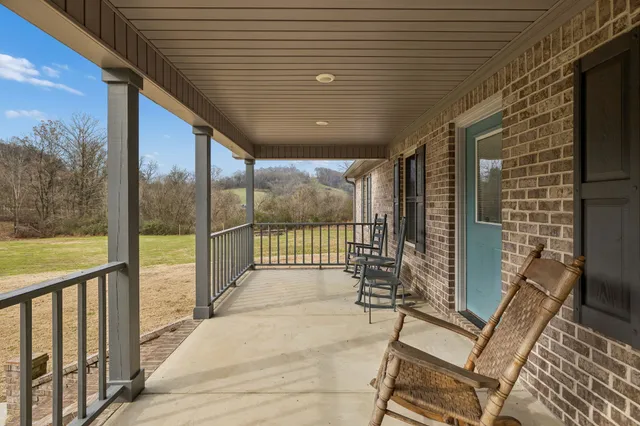 a view of a porch with wooden floor and outdoor space
