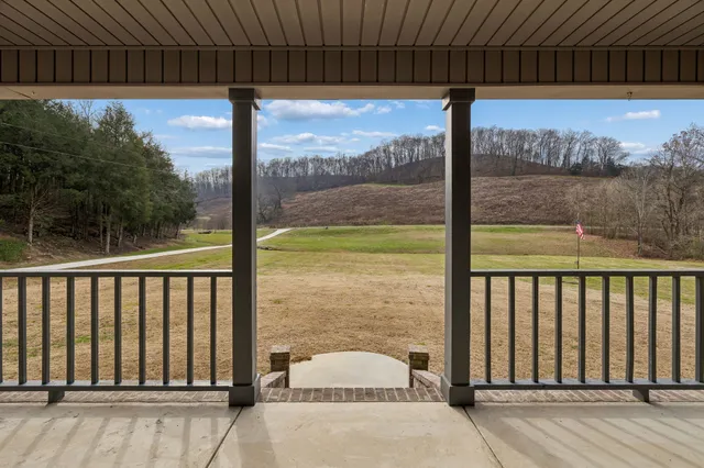 a view of balcony with furniture