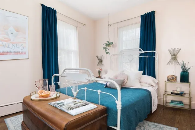 a bedroom with a bed and a table