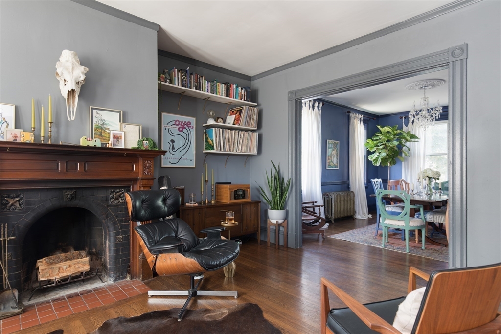 198 Byron Street Boston, MA 02128 - Photo 4 of 18 a living room with furniture and a fireplace