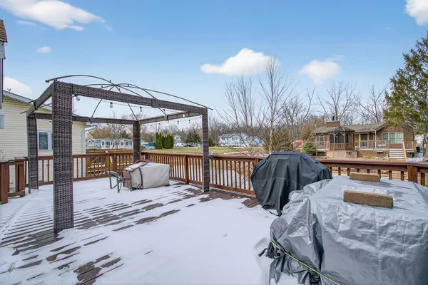a view of a patio with a table and chairs
