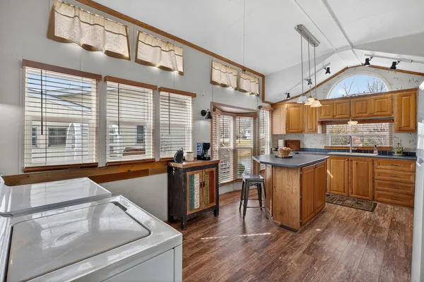 a kitchen that has a sink and a stove