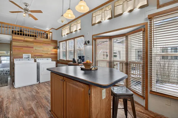a kitchen with sink and refrigerator