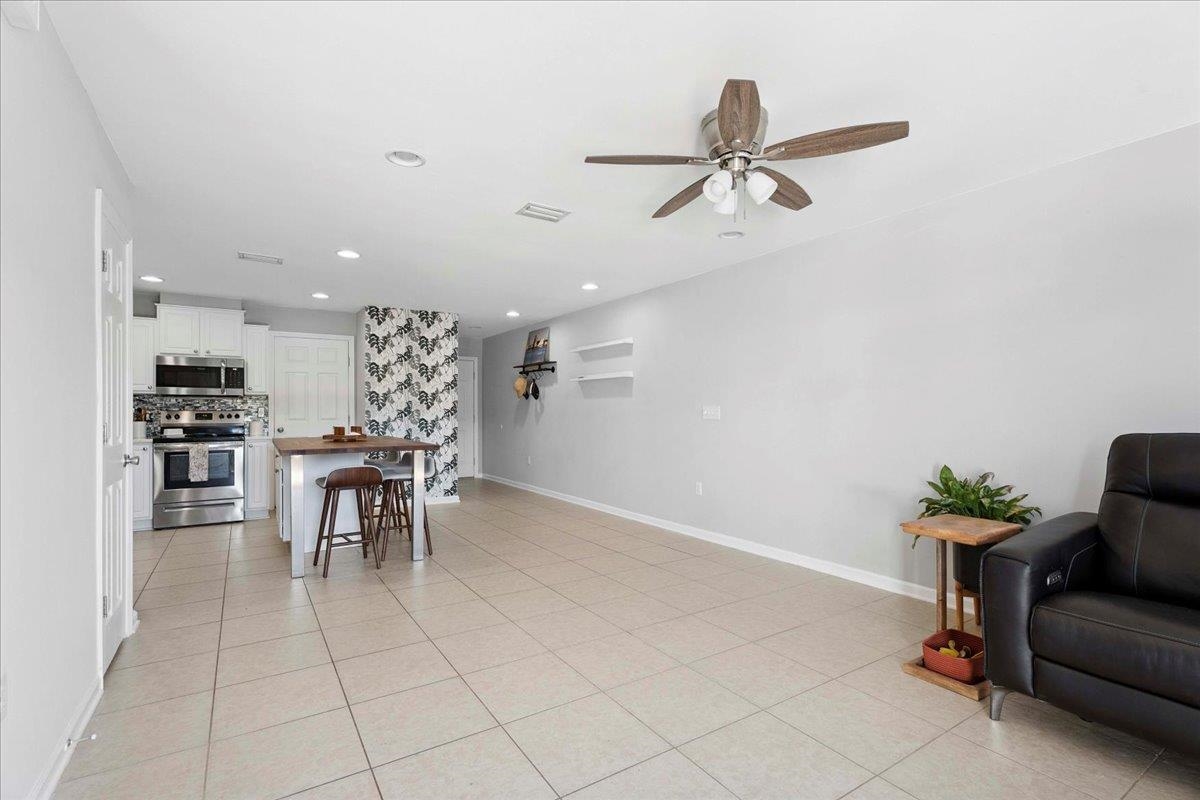 171 Islander Drive St. Augustine, FL 32080 - Photo 12 of 36 a view of a dining room with furniture