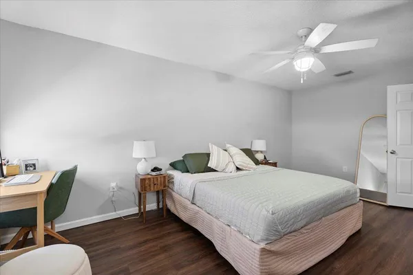 a bedroom with a bed and a table in it