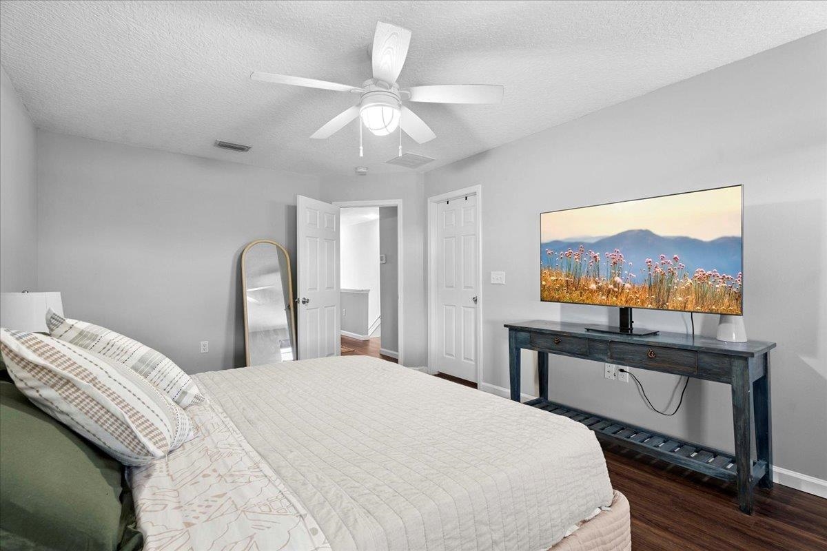 171 Islander Drive St. Augustine, FL 32080 - Photo 16 of 36 a bedroom with a large bed and a flat screen tv