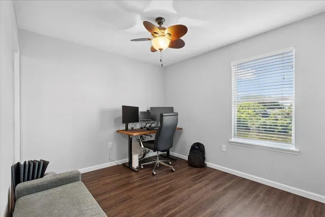 a work room with furniture and a window
