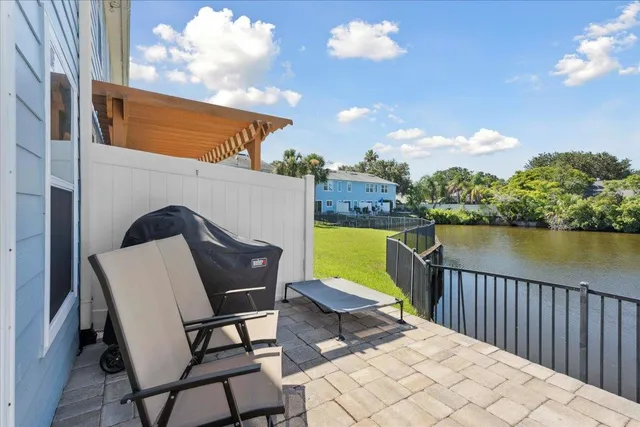 a view of a chairs and table in the balcony