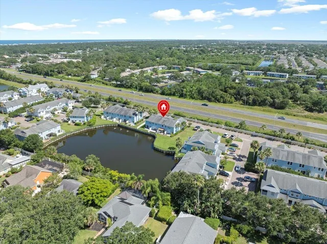an aerial view of a city with mountains