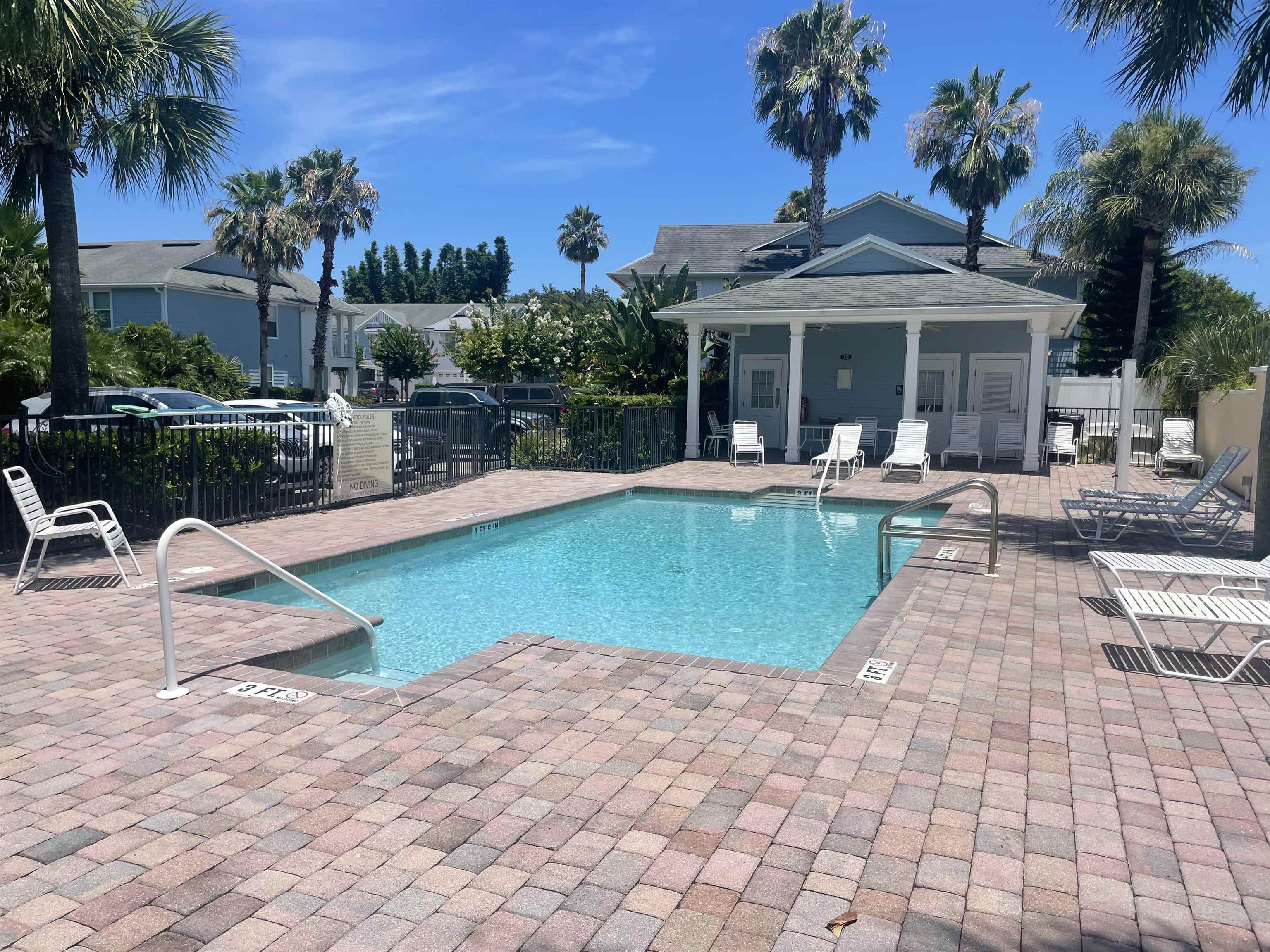 171 Islander Drive St. Augustine, FL 32080 - Photo 34 of 36 a view of a house with swimming pool and sitting area