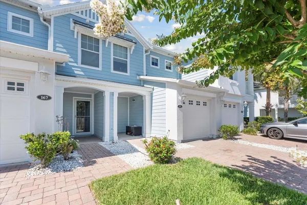 a front view of a house with garden