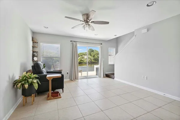 a view of a livingroom with furniture and a potted plant
