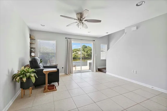 a view of a livingroom with furniture and a potted plant