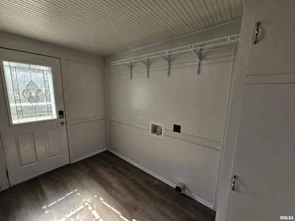 a bathroom with a shower and a sink