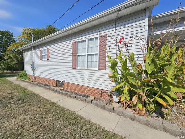 a view of a house with a window and yard