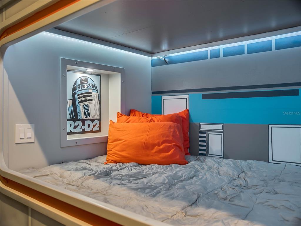 1231 Radiant Street Reunion, FL 34747 - Photo 12 of 26 a bed room with a bed and two large window