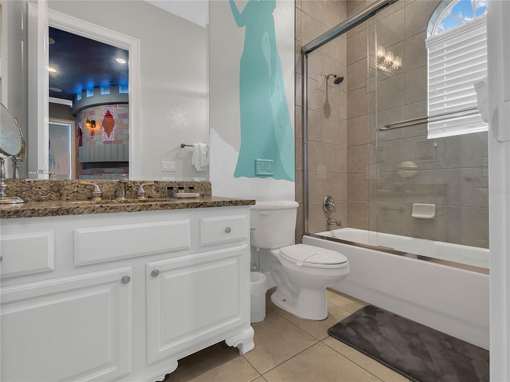 1231 Radiant Street Reunion, FL 34747 - Photo 15 of 26 a bathroom with a sink a toilet and shower