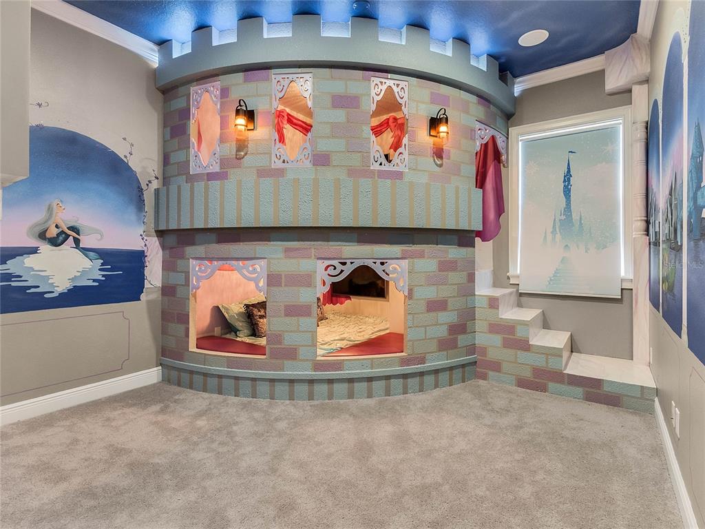 1231 Radiant Street Reunion, FL 34747 - Photo 17 of 26 a picture of a room with toys and wall painting