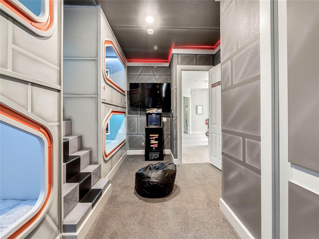 1231 Radiant Street Reunion, FL 34747 - Photo 20 of 26 a kitchen with stainless steel appliances a refrigerator and a sink