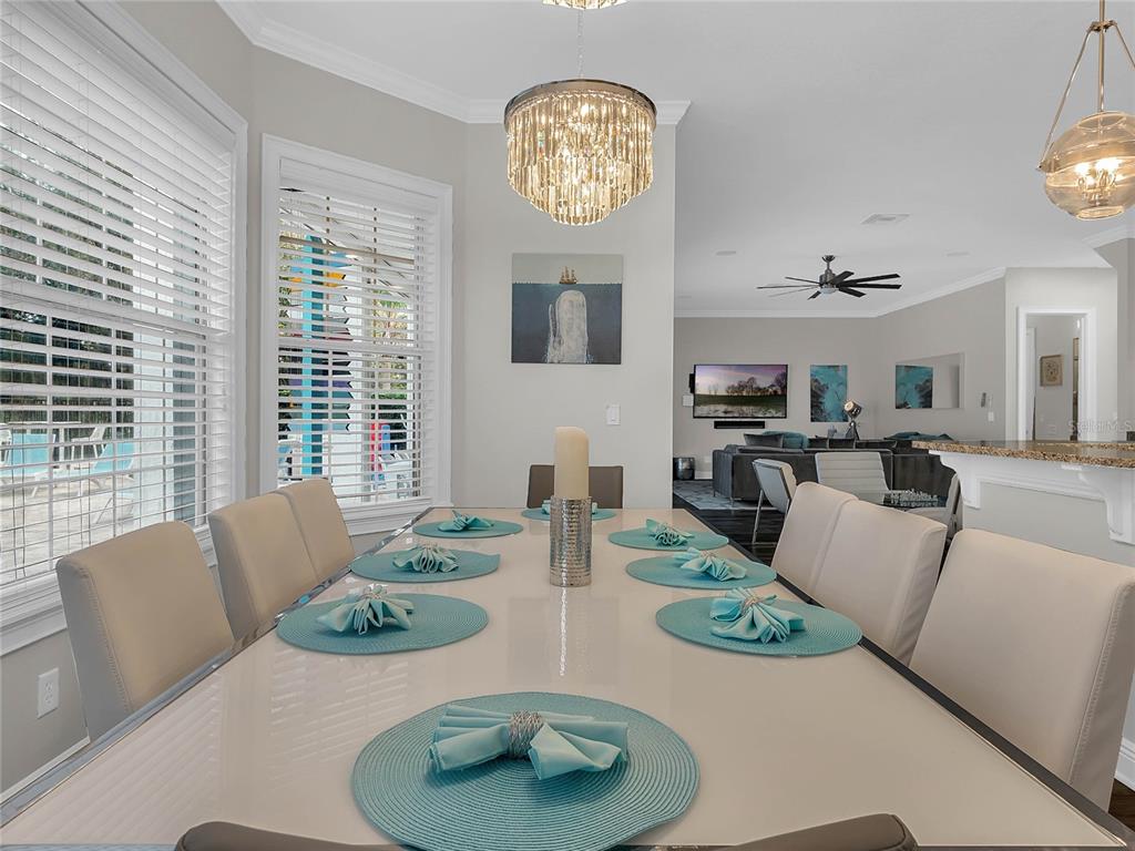 1231 Radiant Street Reunion, FL 34747 - Photo 3 of 26 a view of a dining room with furniture and a large window