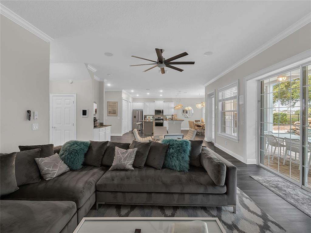 1231 Radiant Street Reunion, FL 34747 - Photo 5 of 26 a living room with furniture and a large window