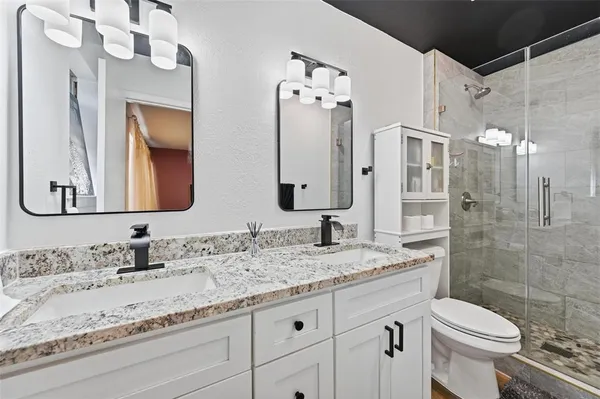 a bedroom with a bed and a television