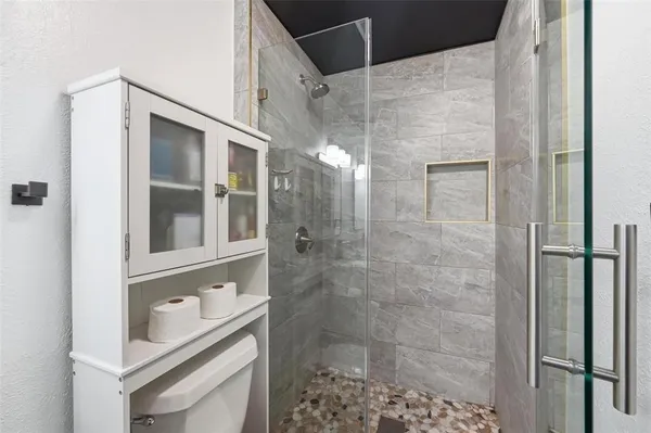 a bathroom with a granite countertop sink mirror and double