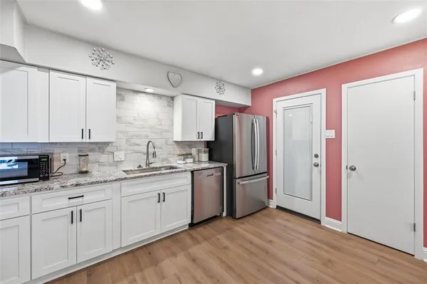 a kitchen with a stove and a microwave