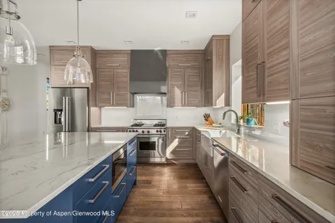 a view of a sink and wooden floor