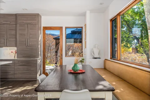 a tennis court view of houses with a tennis court