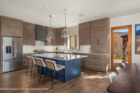 a large bed sitting in a bedroom next to a window