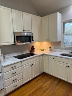 5544 South New Hope Road Hermitage, TN 37076 - Photo 48 of 62 a kitchen with granite countertop white cabinets and stainless steel appliances
